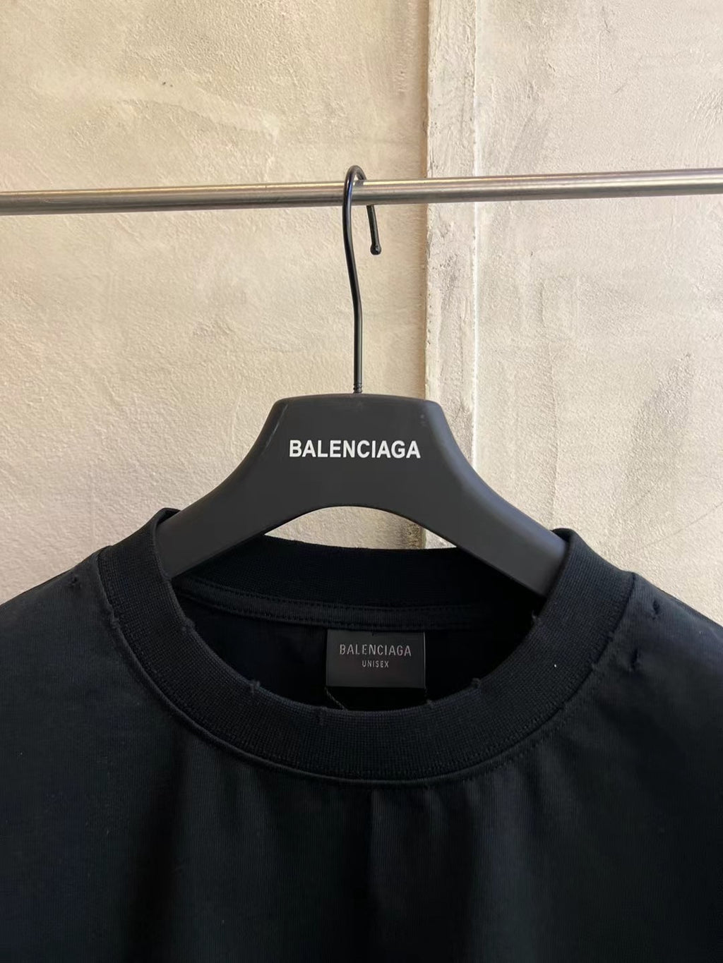 Black Balenciaga graphic crew-neck T-shirt on hanger