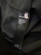 Balenciaga T-shirt care label on dark navy fabric