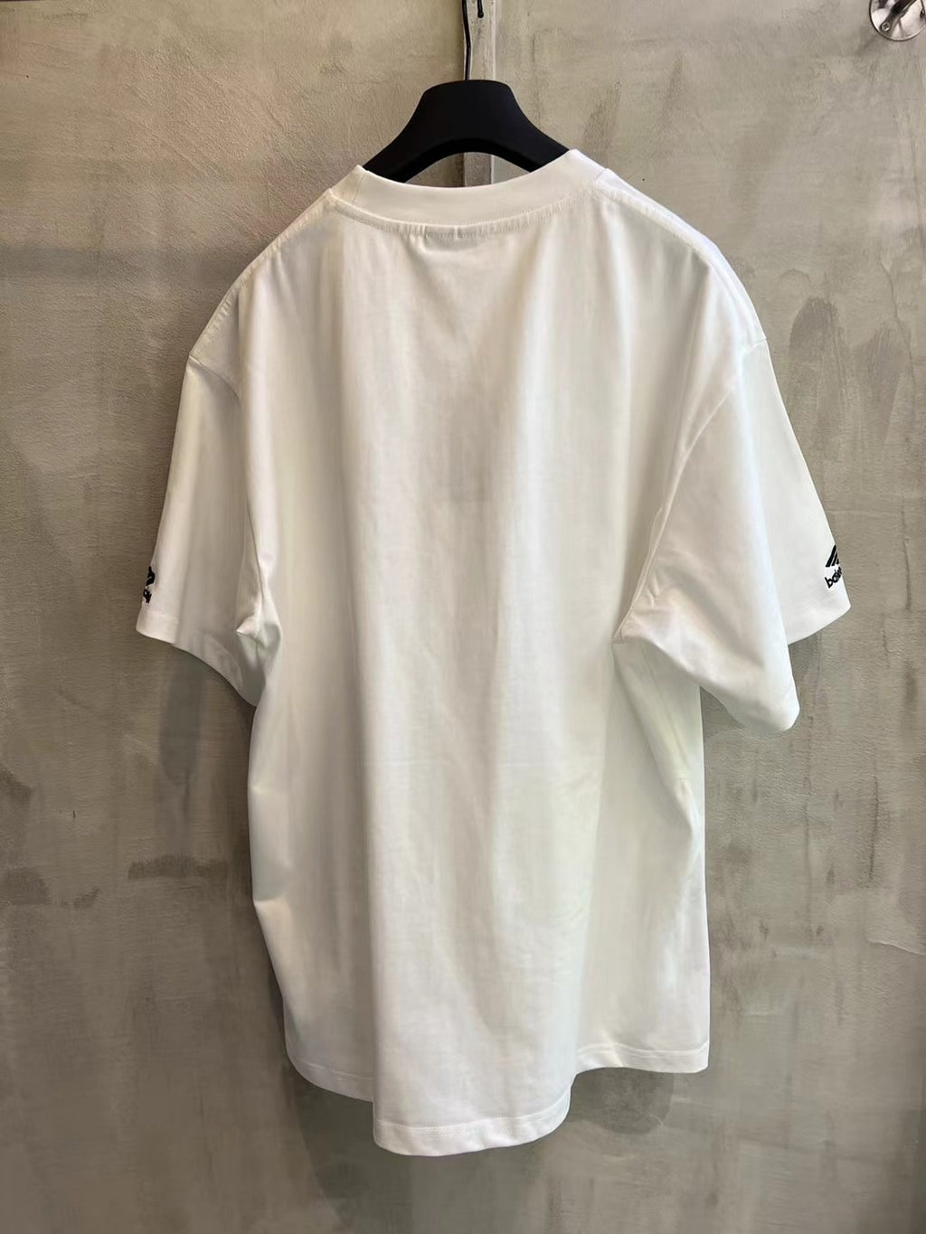 White short-sleeve T-shirt, back view with small sleeve logo