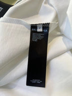 White short-sleeve T-shirt with hanging size and care label