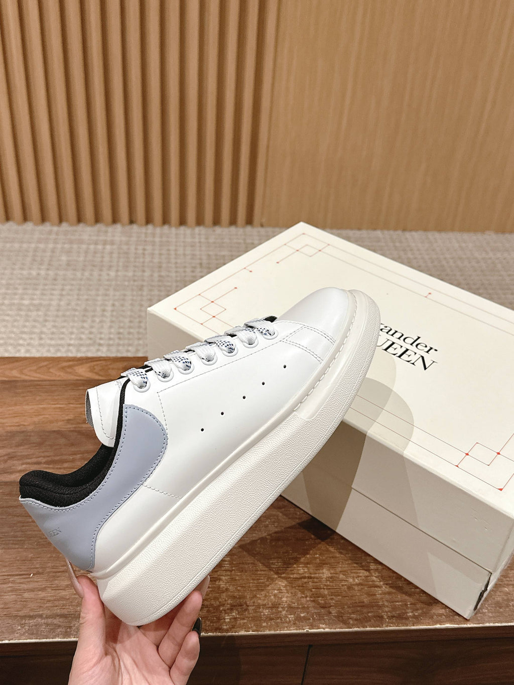 Alexander McQueen white leather low-top sneakers with black heel collar