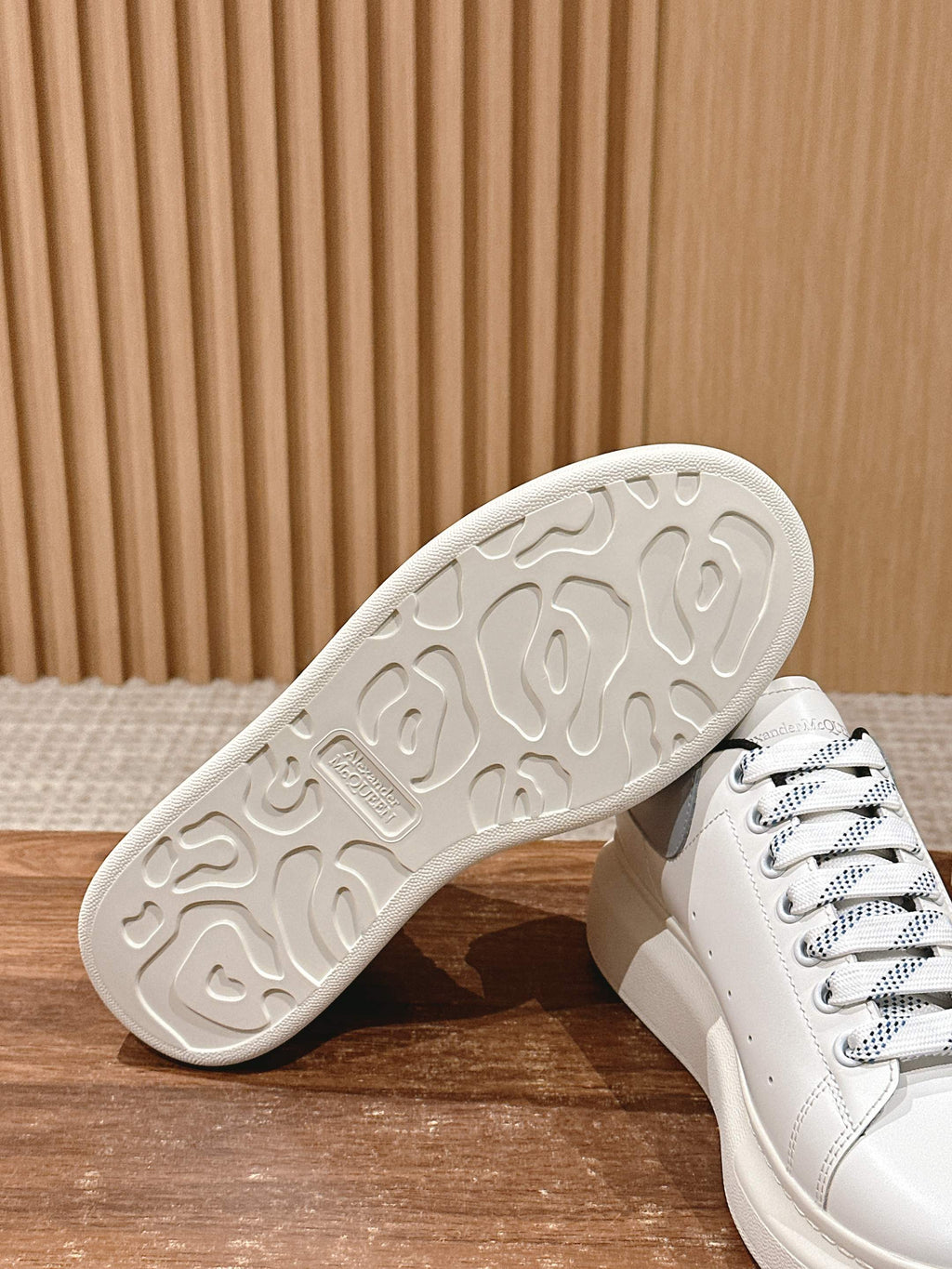 White rubber outsole of lace-up sneakers with tread detail