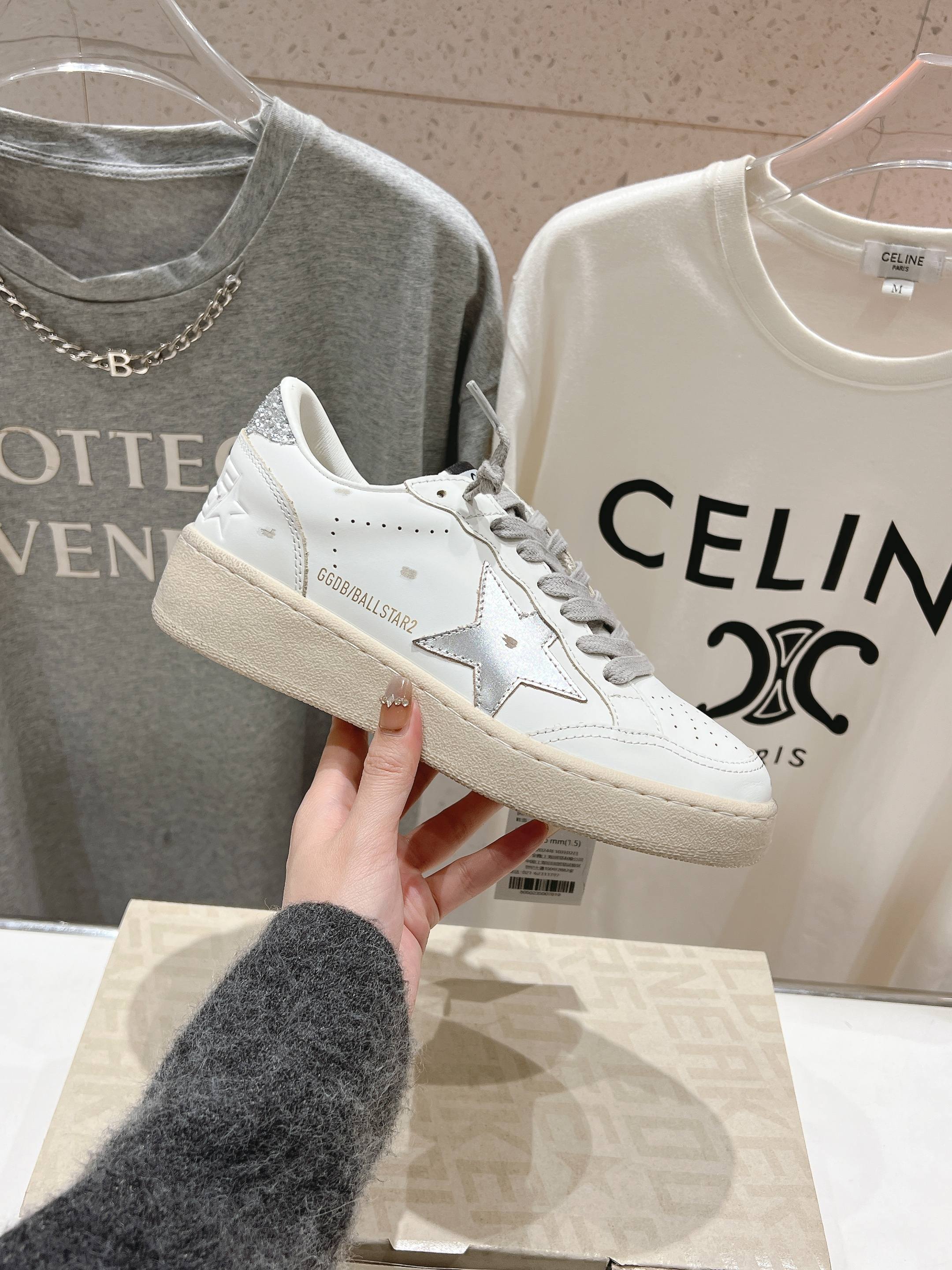 Golden Goose white sneaker with gray laces, glitter side star and light sole