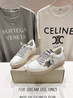 Golden Goose white sneakers with gray laces, star logo on the side