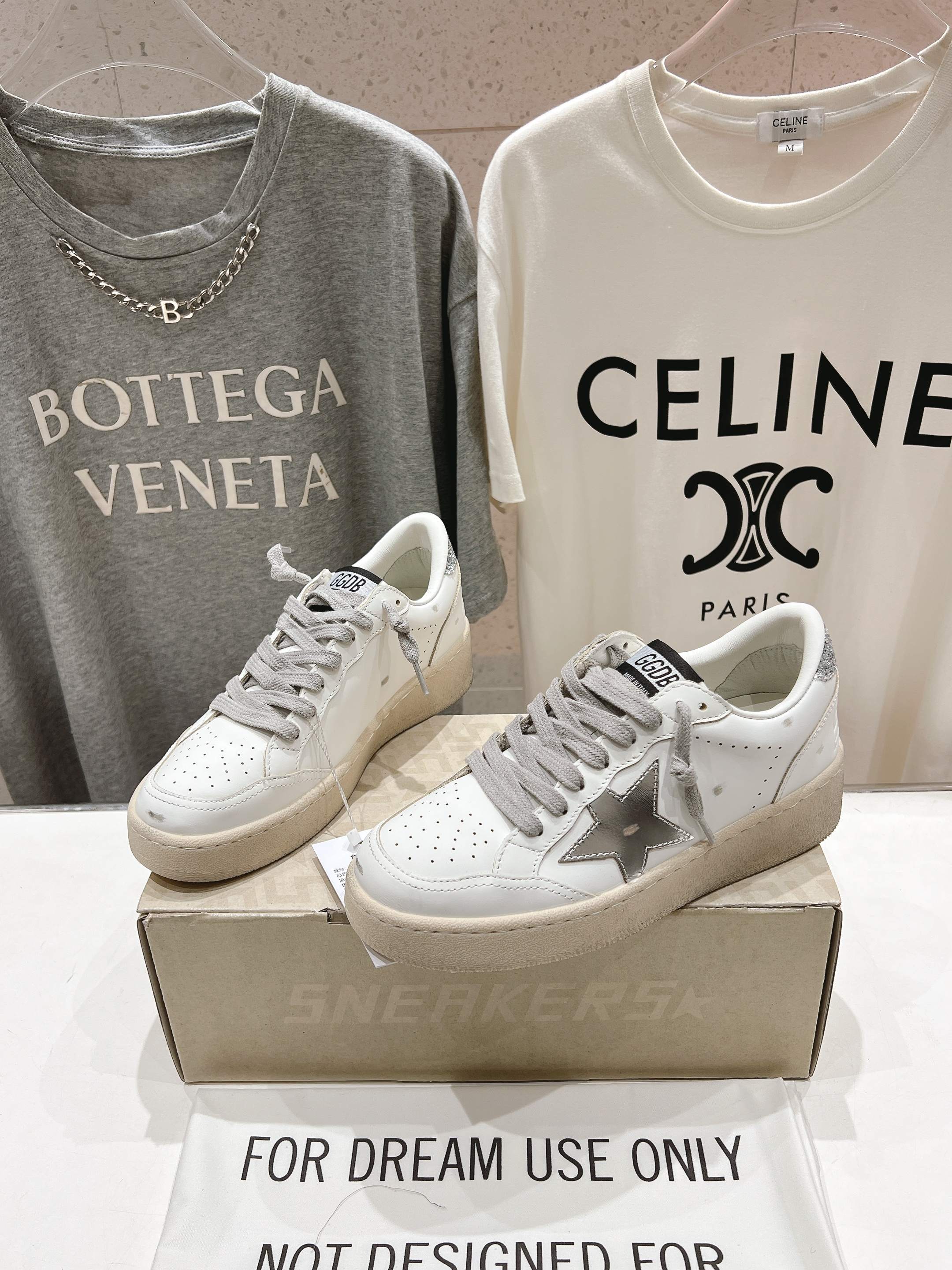 Golden Goose white sneakers with gray laces, star logo on the side