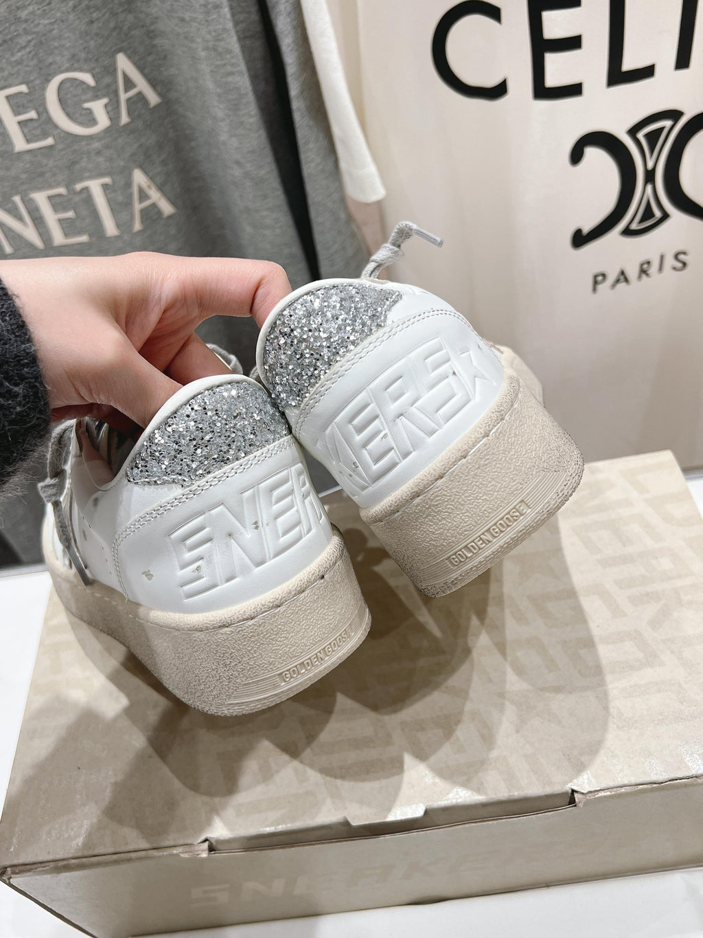 Golden Goose white sneakers with gray laces, glitter heel detail and embossed sole