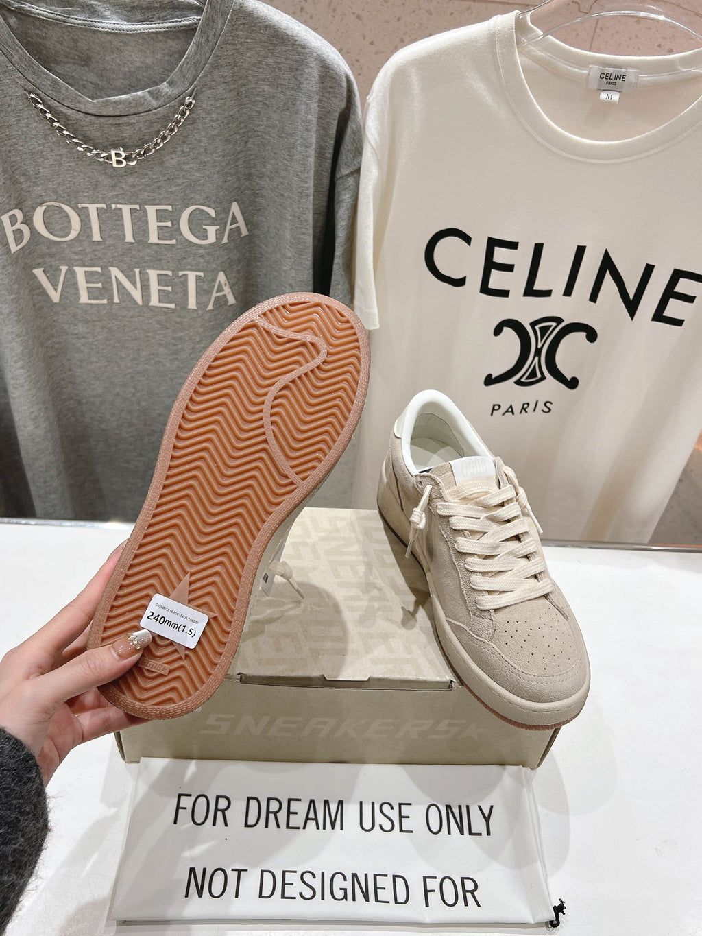 White sneakers with textured tan rubber outsole, side and sole view