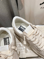 White sneakers close-up on laces and inner tongue label