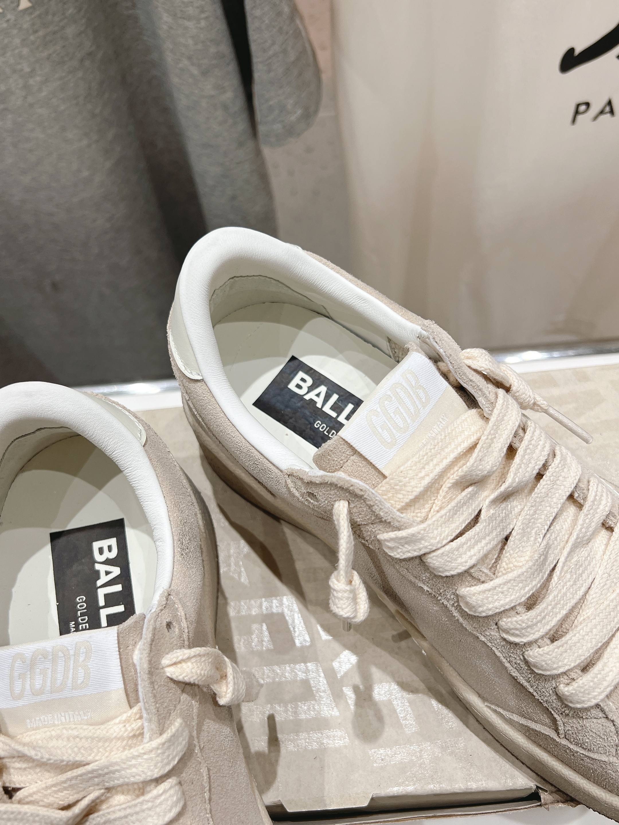 White sneakers close-up on laces and inner tongue label