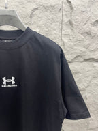 Dark navy short-sleeve T-shirt with chest logo and partial sleeve graphic