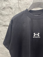 Dark navy short-sleeve T-shirt with white emblem and BALENCIAGA text logo