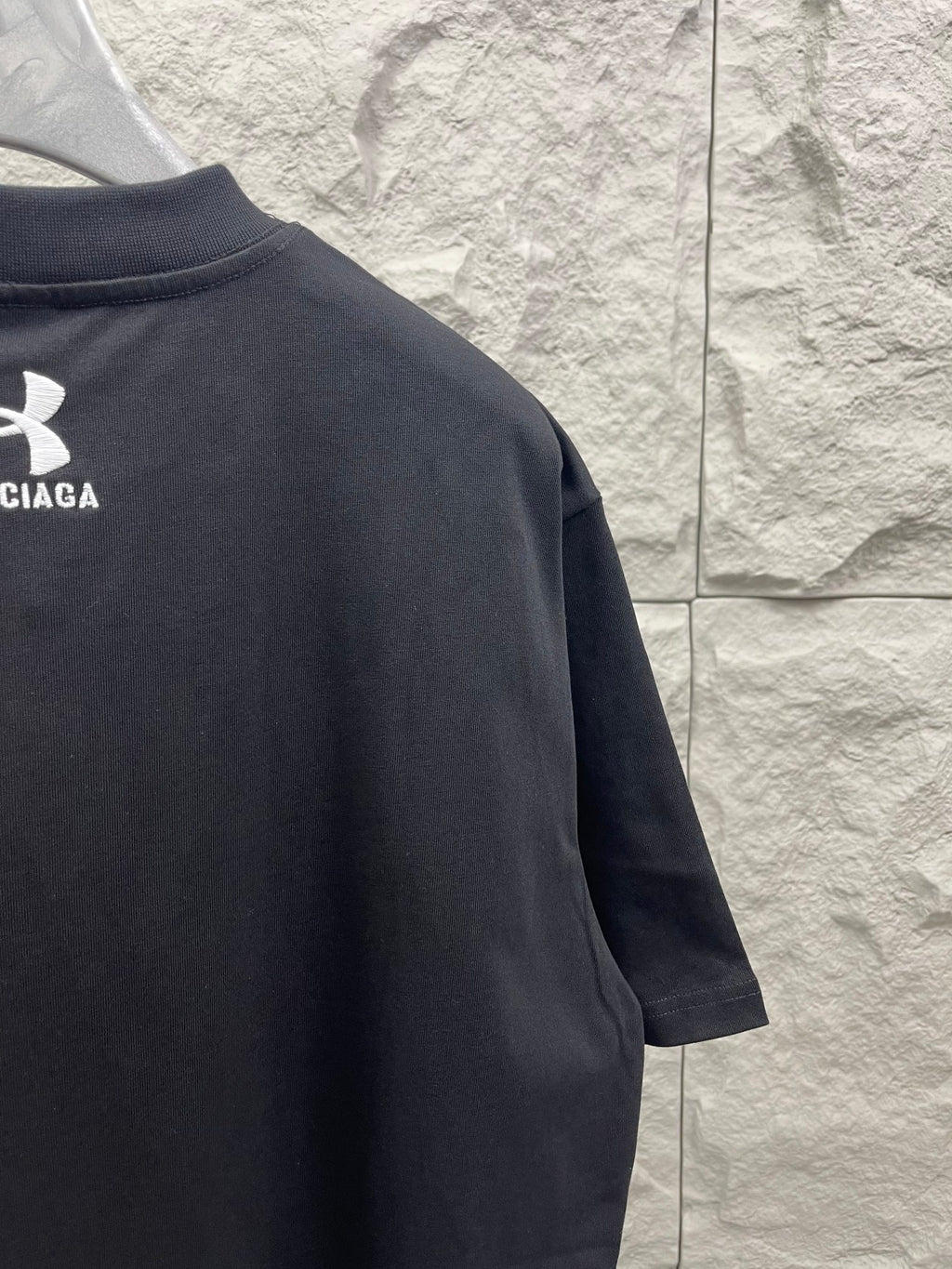 Dark navy short-sleeve T-shirt with logo print on the upper back