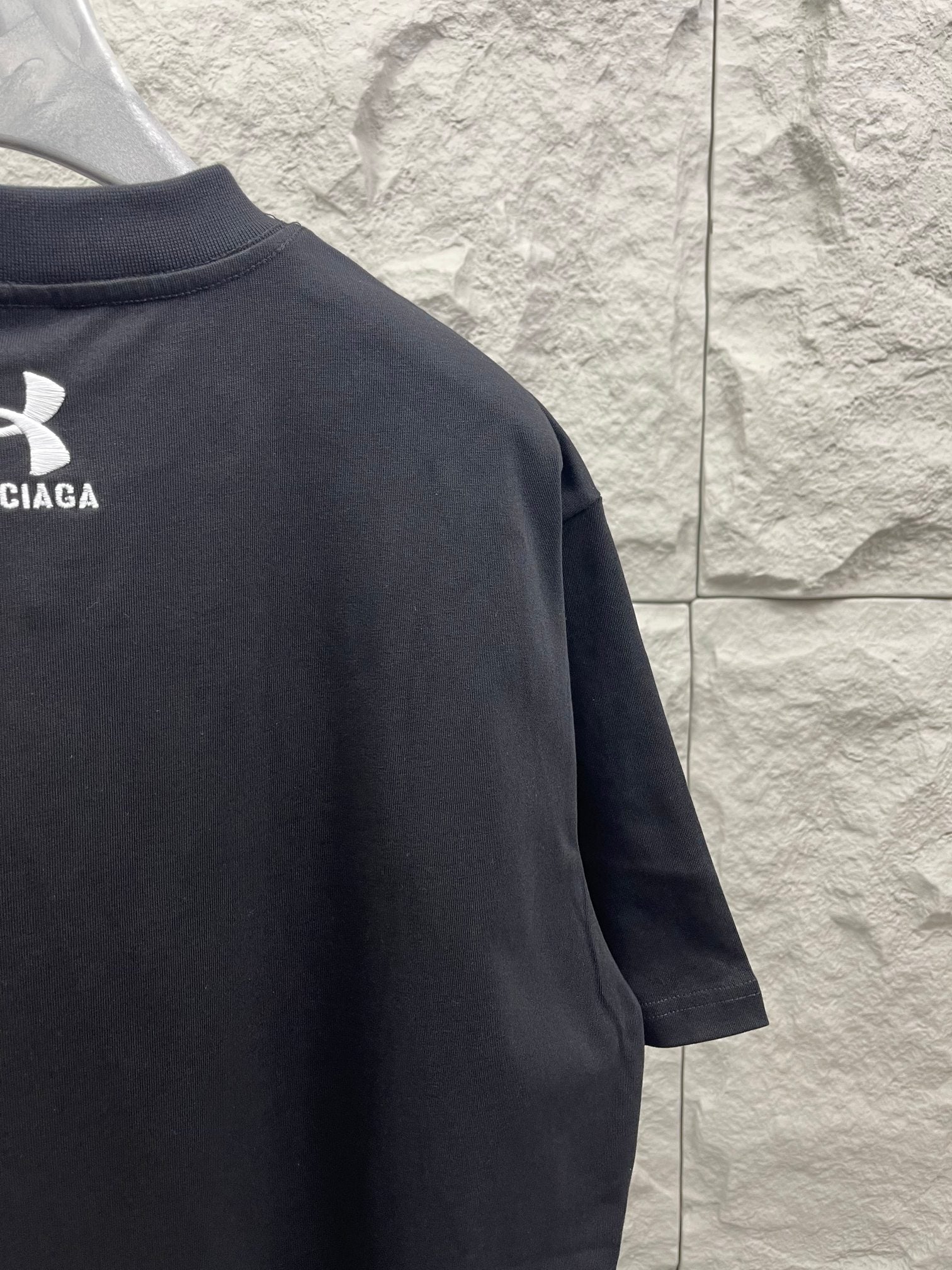 Dark navy short-sleeve T-shirt with logo print on the upper back