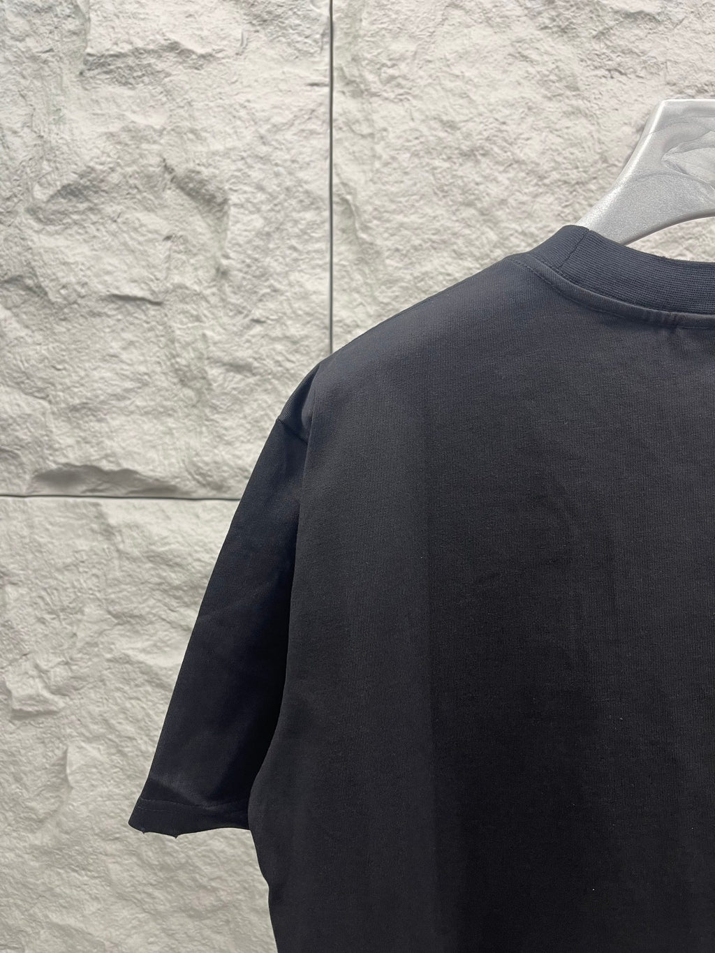 Dark crewneck T-shirt back and sleeve view
