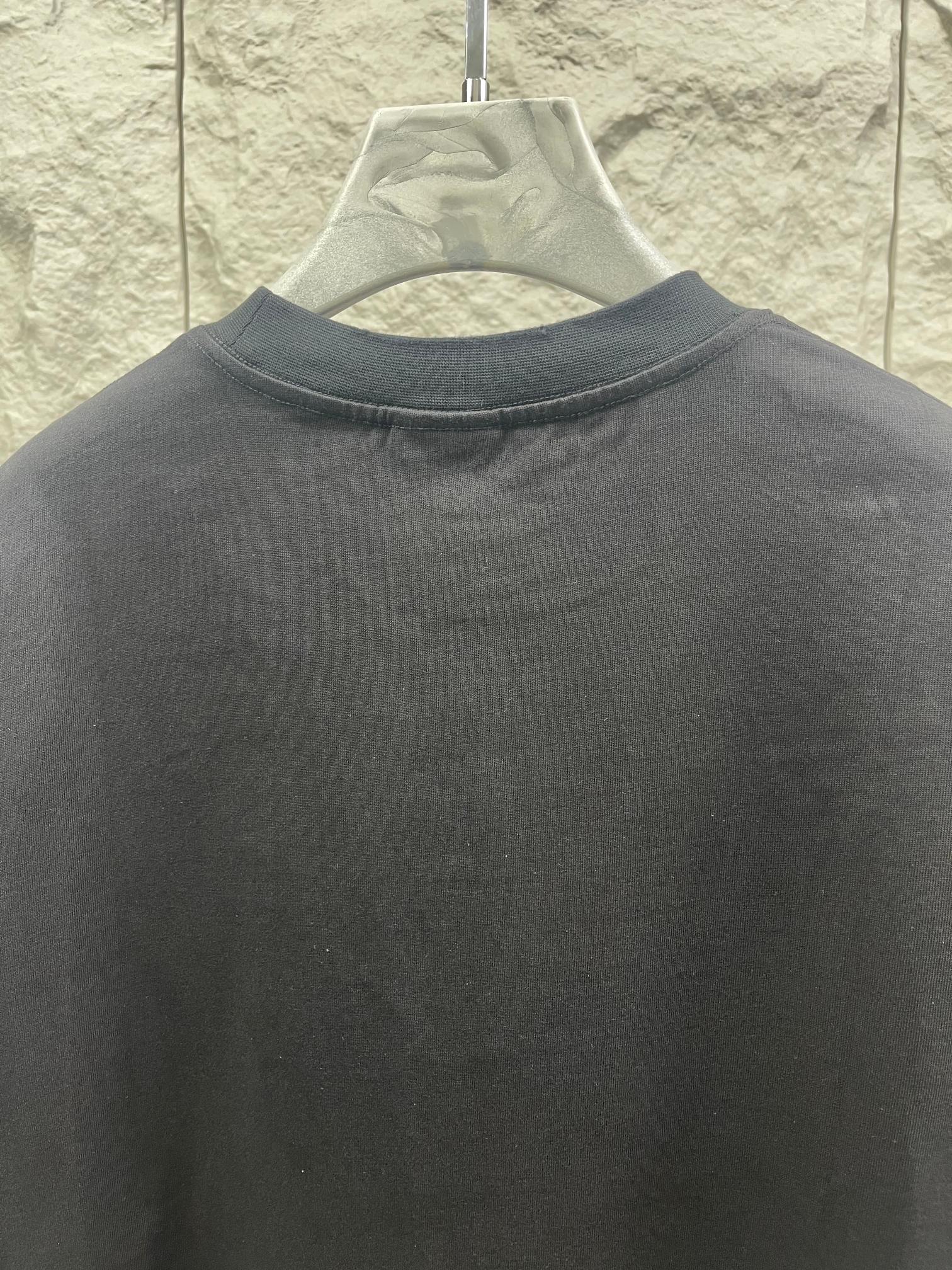 Dark graphic T-shirt back neck close-up with crew collar
