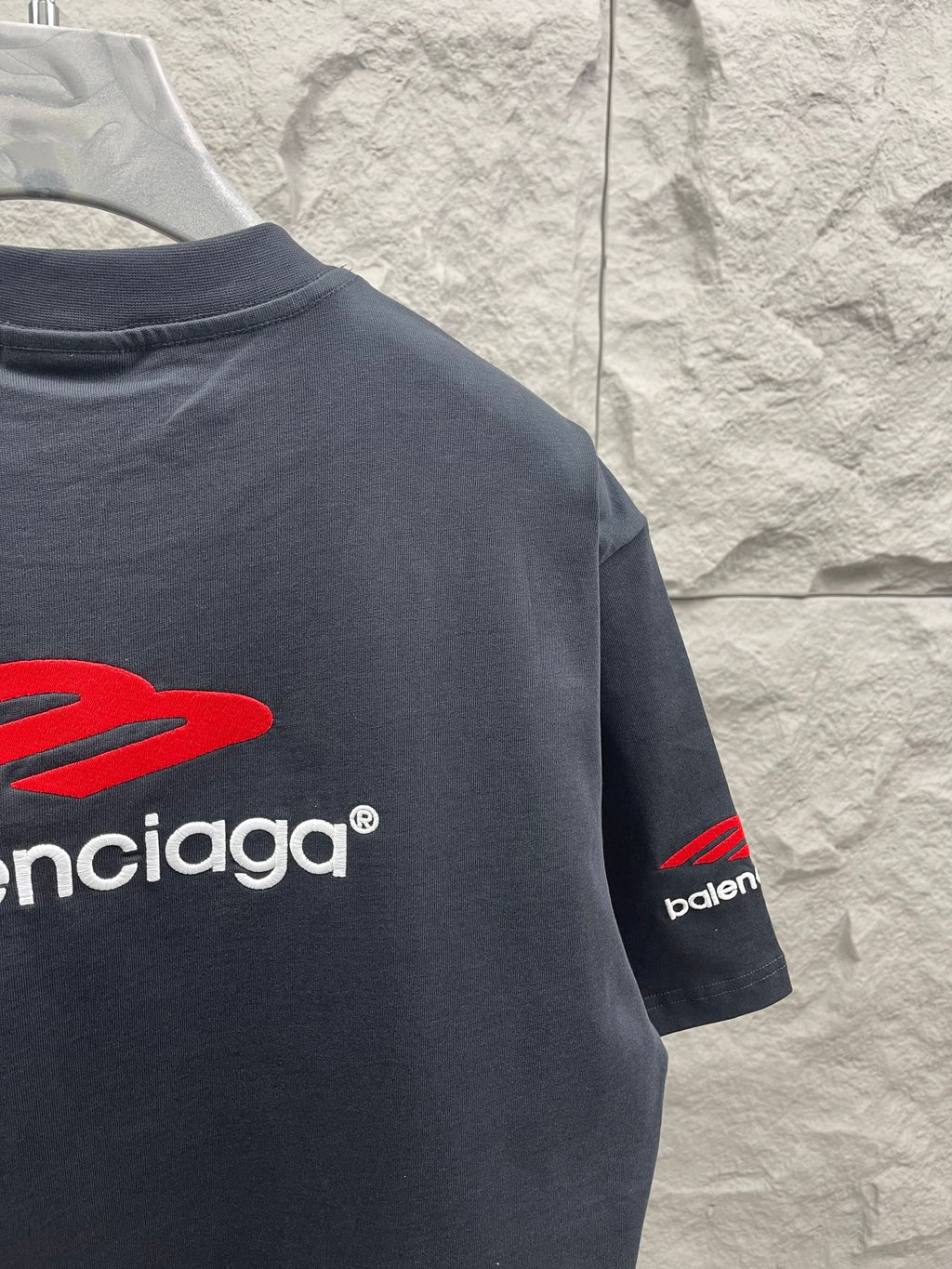 Balenciaga short-sleeve T-shirt in dark navy with red logo and “balenciaga” text on back