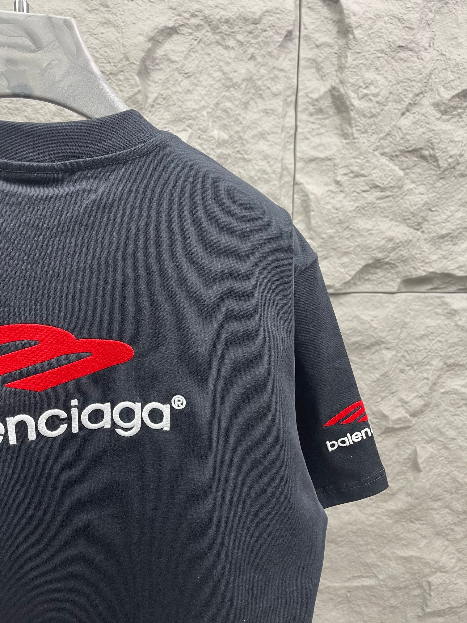 Balenciaga short-sleeve T-shirt in dark navy with red logo and “balenciaga” text on back