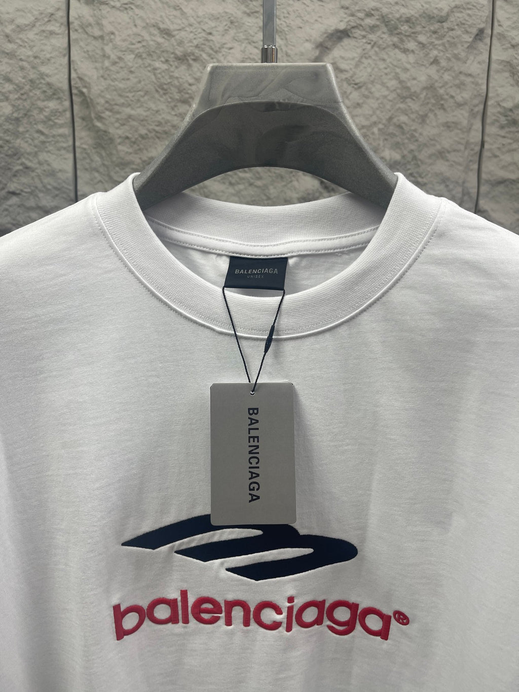 White Balenciaga T-shirt neckline with logo graphic and hanging tag