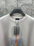 White T-shirt close-up with crew neck trim and Balenciaga hang tag