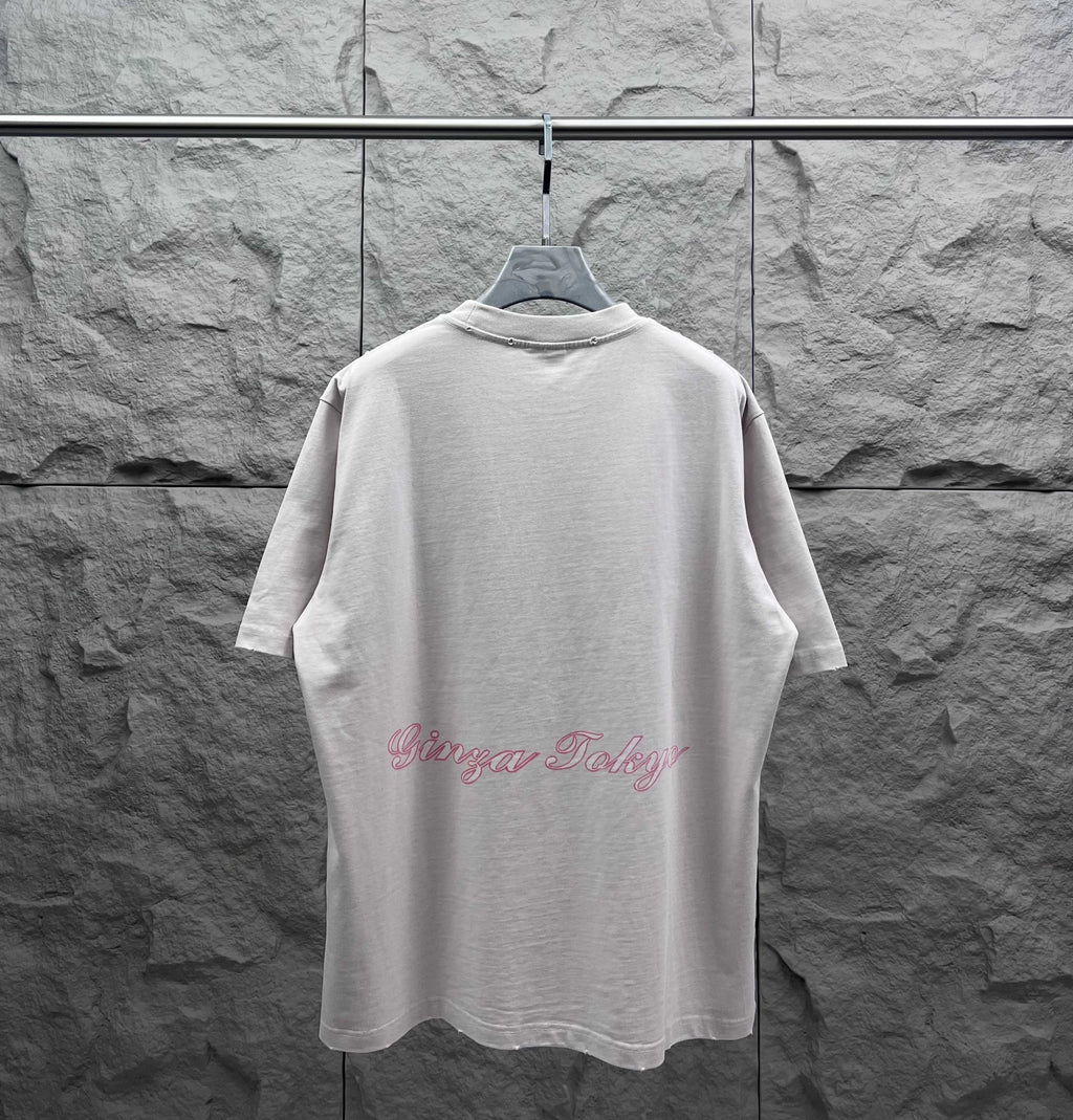 White short-sleeve T-shirt back view with red scripted logo along the hem