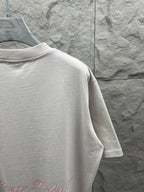 White T-shirt back view with red script logo near the lower back