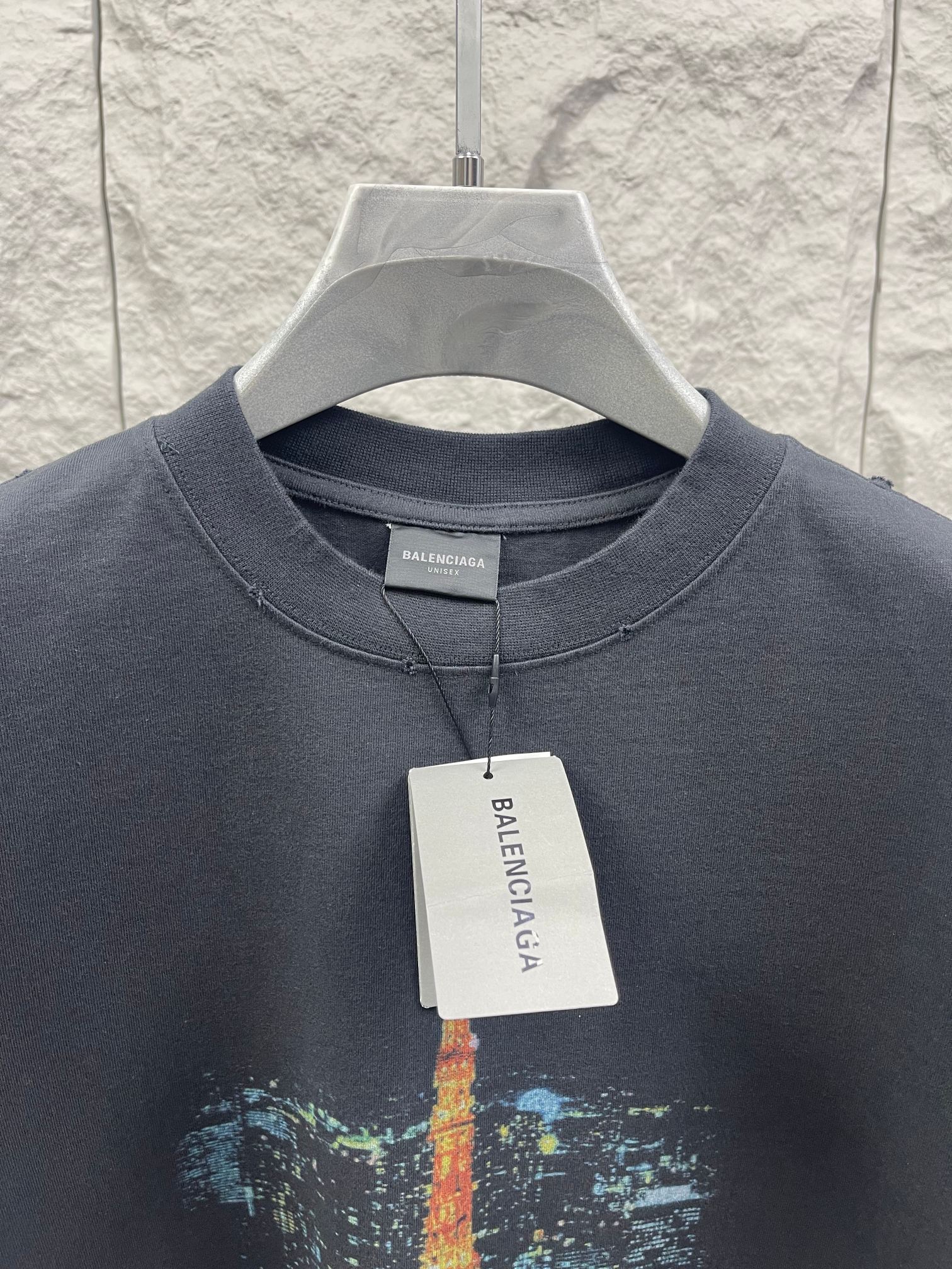 Dark gray short-sleeve T-shirt with crew neck, buttonless placket, and Eiffel Tower print