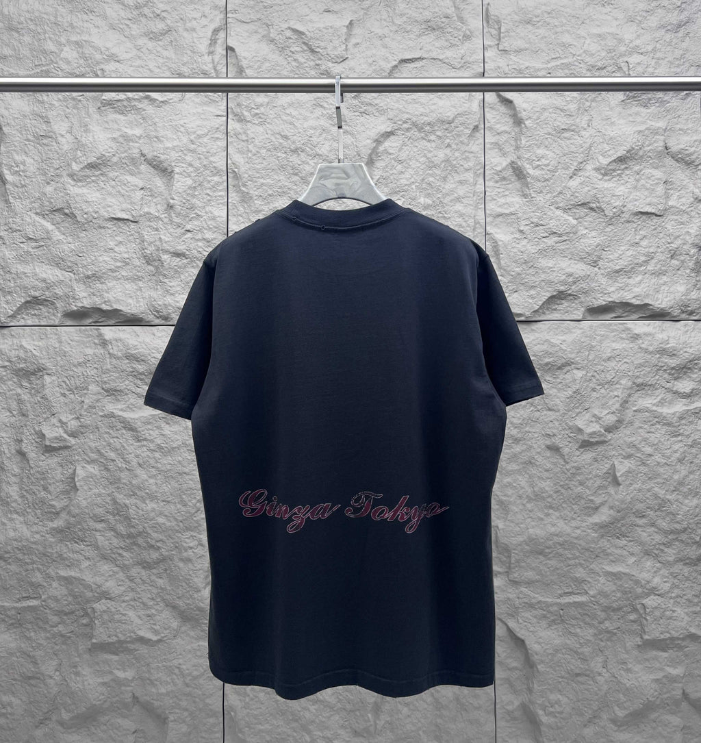 Navy short-sleeve T-shirt with Eiffel Tower graphic and cursive logo text on the back