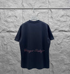 Navy short-sleeve T-shirt with Eiffel Tower graphic and cursive logo text on the back