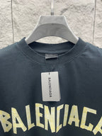 Dark T-shirt collar and chest graphic with brand tag