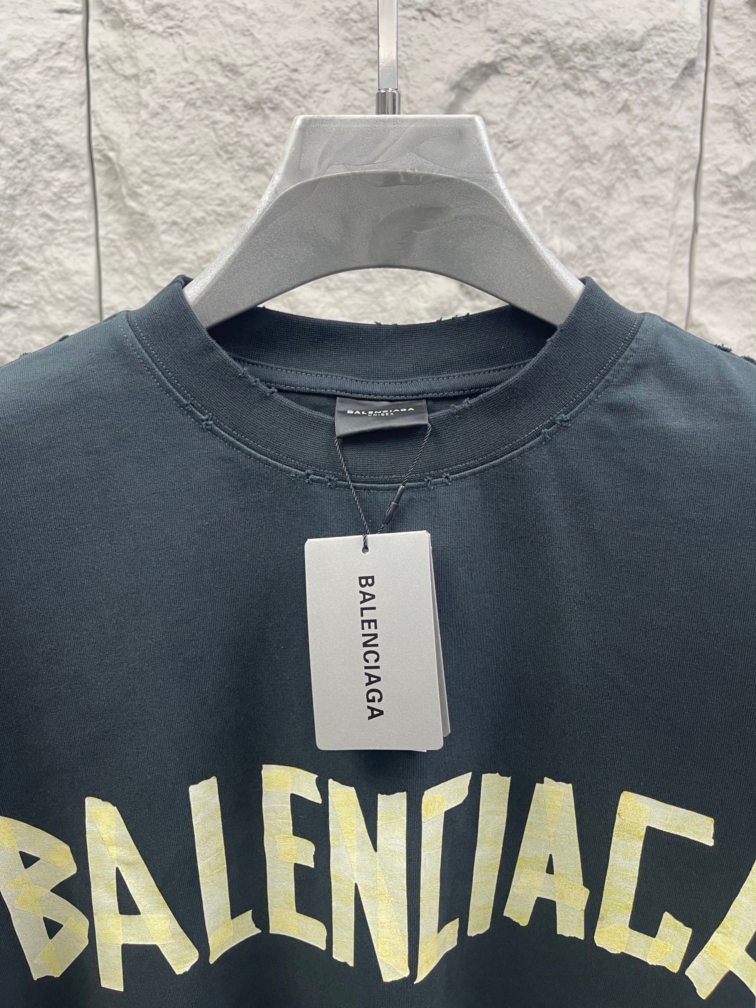 Dark T-shirt collar and chest graphic with brand tag