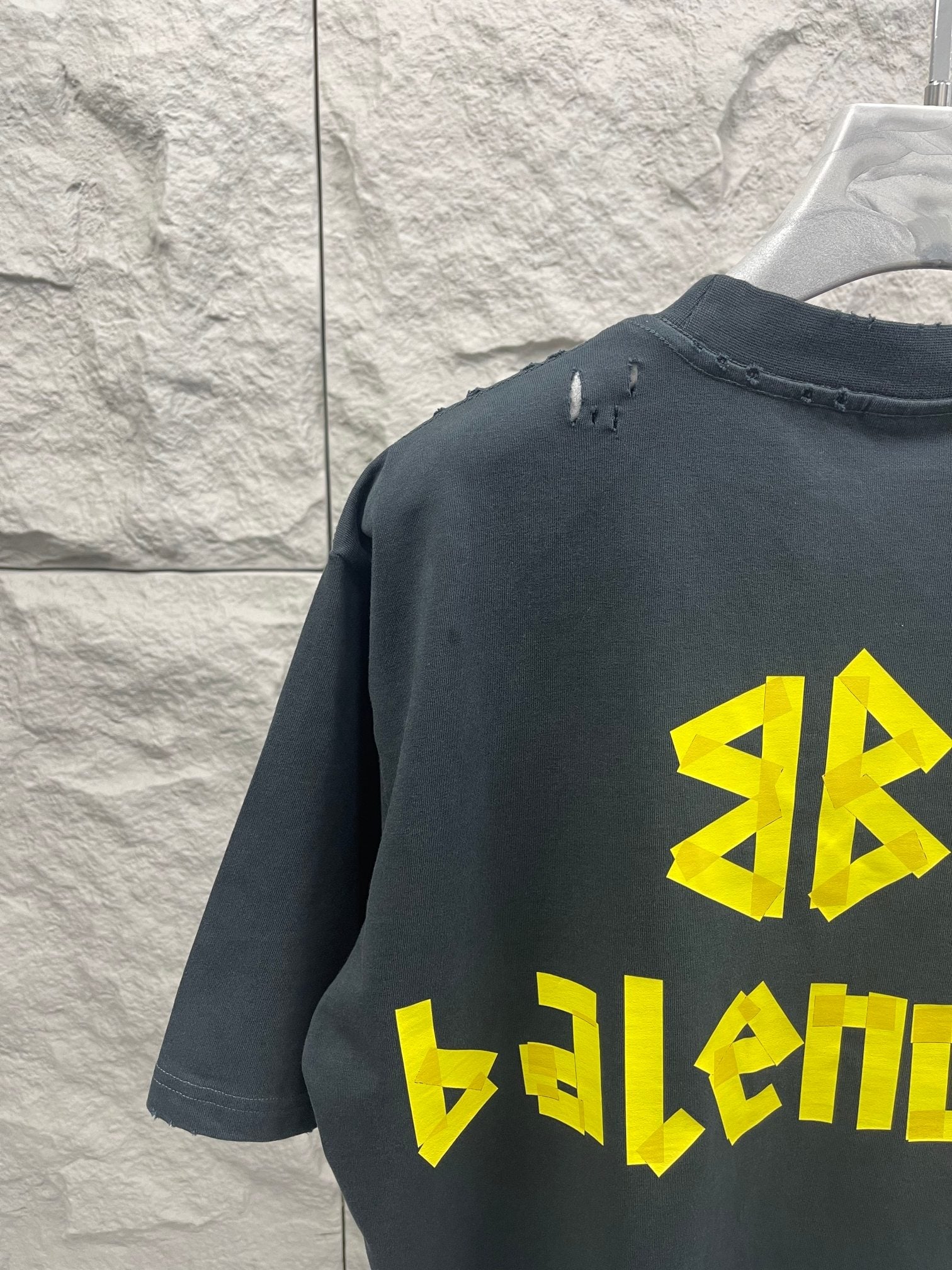 Balenciaga short-sleeve T-shirt, dark navy, back view with yellow logo and stitched collar