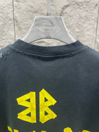 Balenciaga short-sleeve T-shirt, dark navy, back view with yellow logo graphic