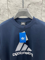 Balenciaga T-shirt close-up, navy blue, front logo and brand hang tag