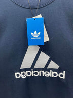 Balenciaga T-shirt close-up, navy blue, logo print with balenciaga hang tag