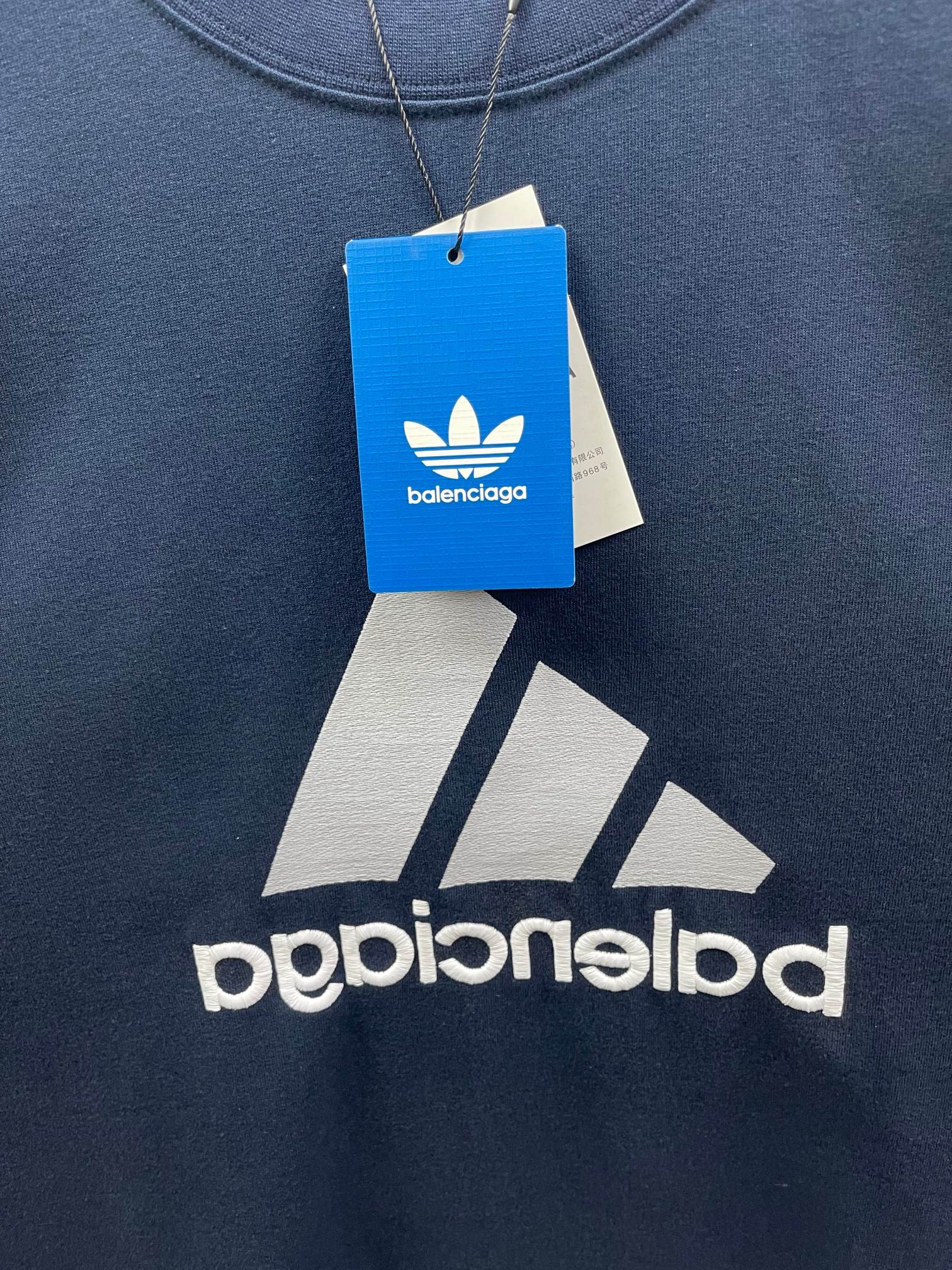 Balenciaga T-shirt close-up, navy blue, logo print with balenciaga hang tag