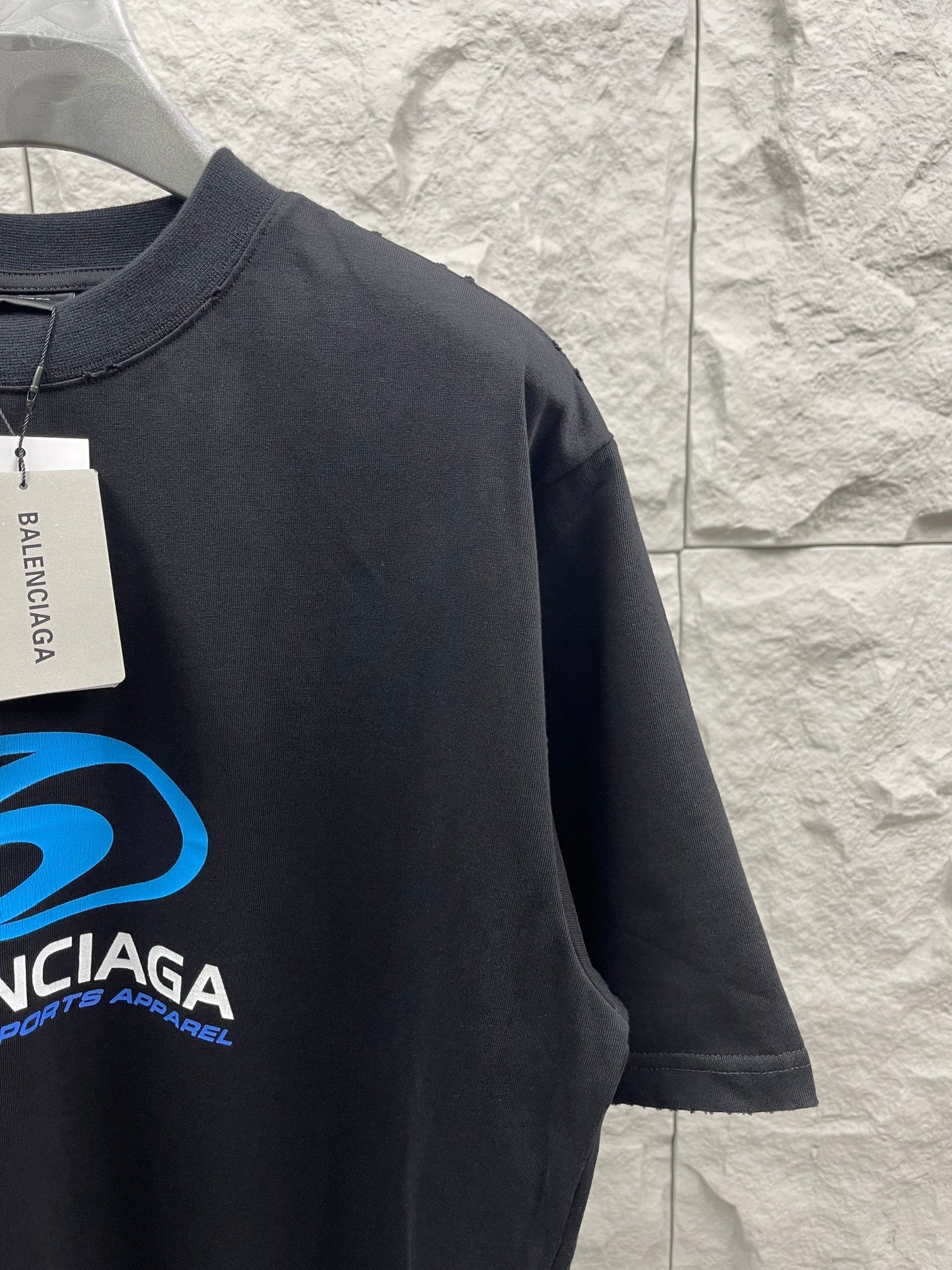 Balenciaga short-sleeve T-shirt with partial blue logo graphic and sleeve hem