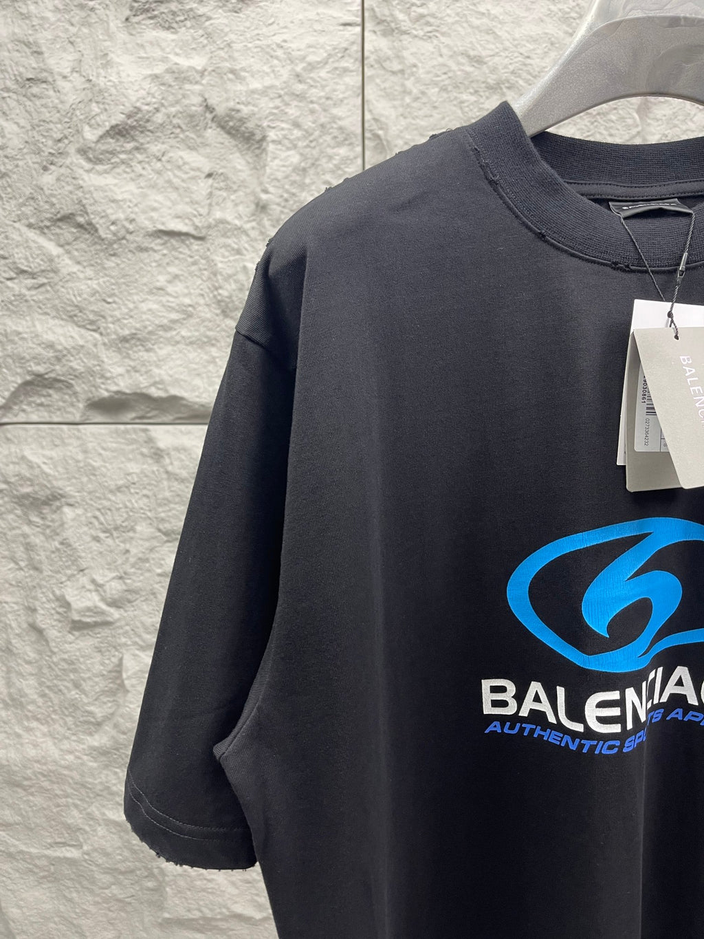 Balenciaga short-sleeve T-shirt, dark fabric with blue logo graphic on chest