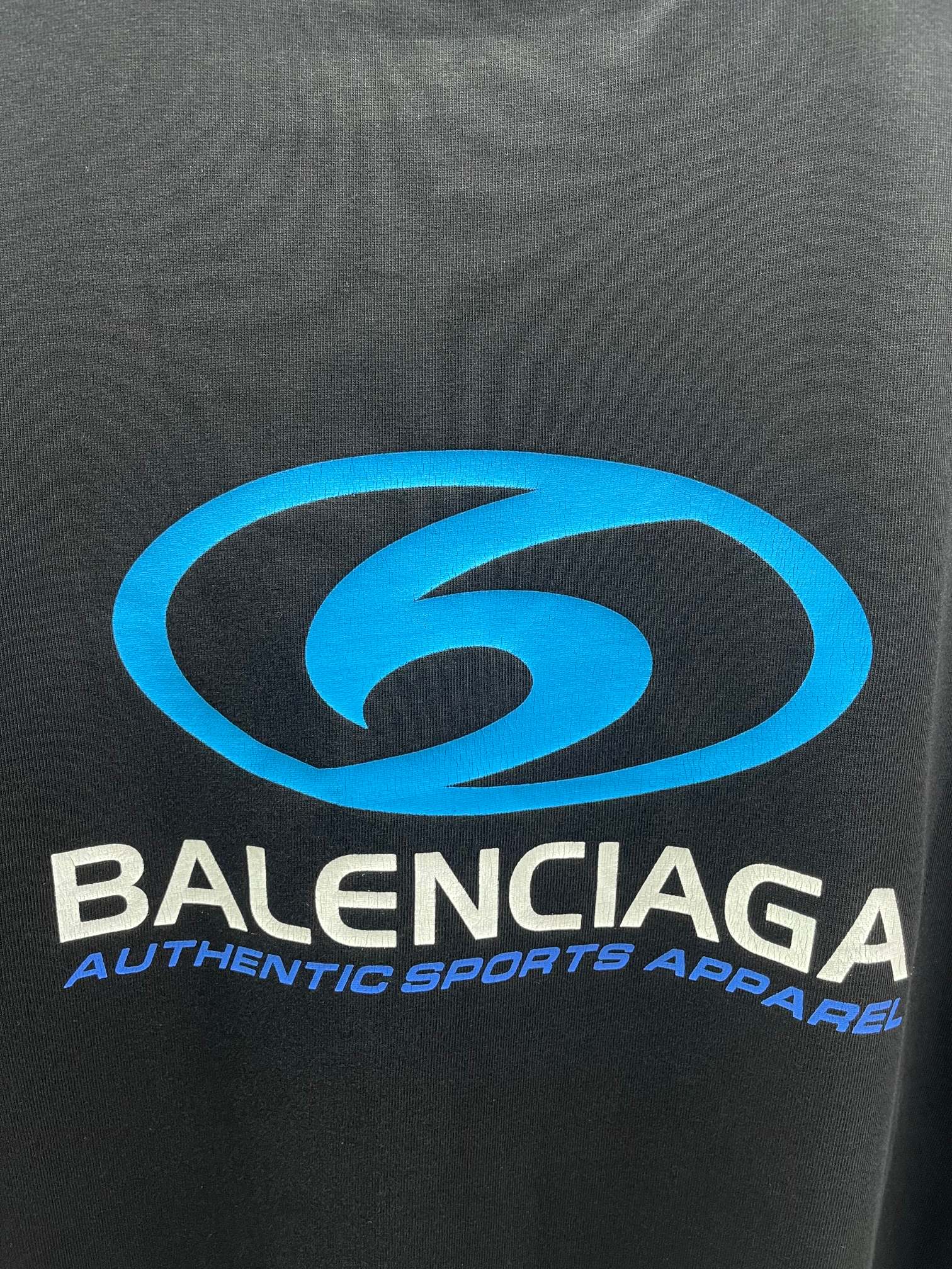 Balenciaga short-sleeve T-shirt close-up of blue logo and brand text