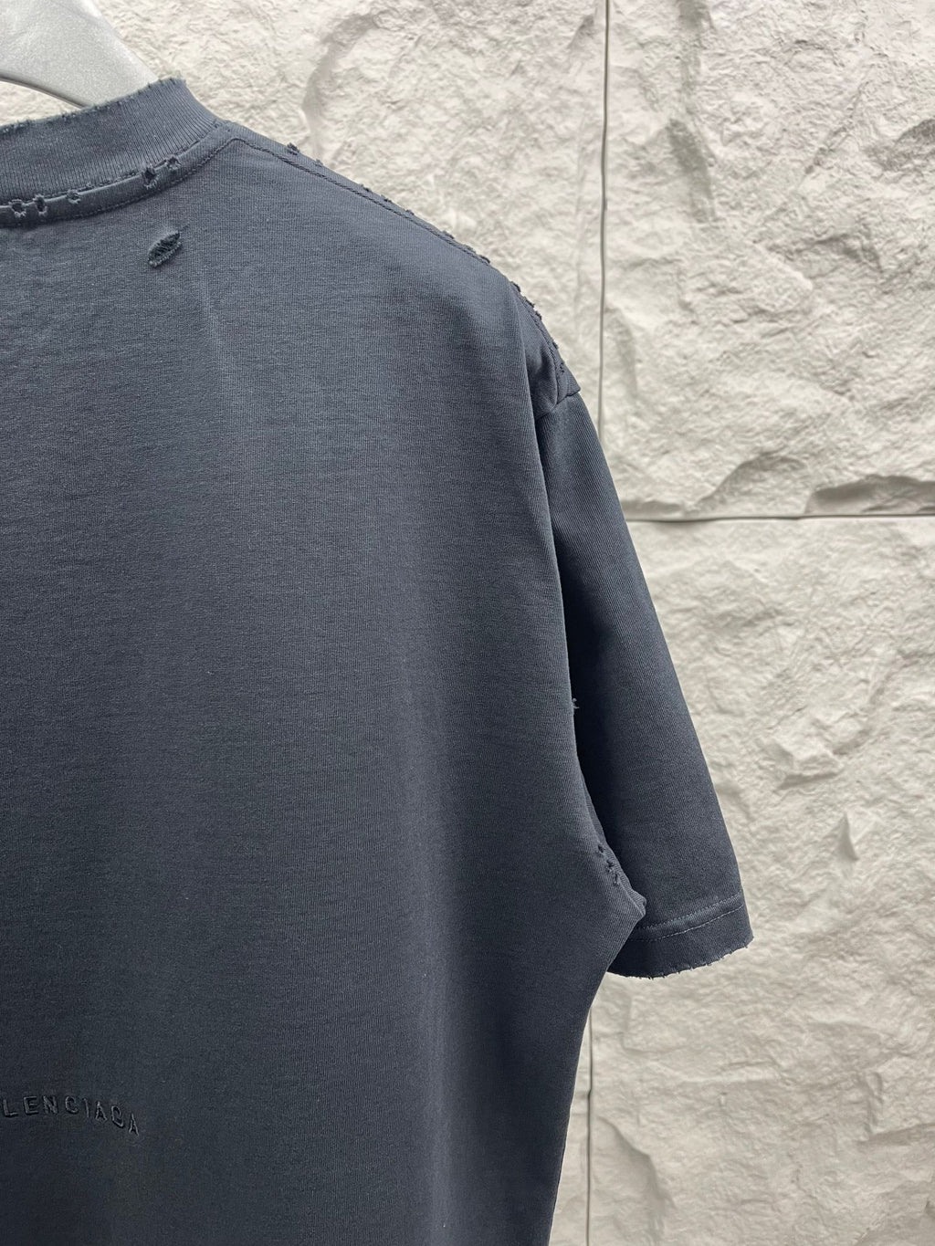 Balenciaga dark navy T-shirt shoulder seam with small distressed holes