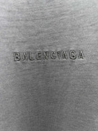 Balenciaga fabric close-up with embossed BALENCIAGA logo text
