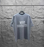 Grey crewneck T-shirt with large front logo graphic and short sleeves.