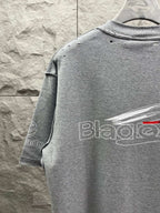 Grey T-shirt back with partial logo print and red detail on text.