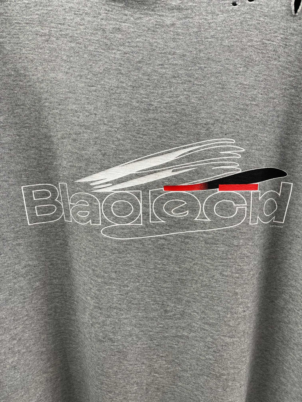 Grey T-shirt with close-up white and red logo graphic print.
