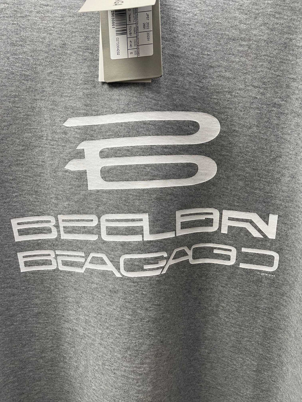 Grey T-shirt with centered white logo graphic detail.