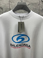 White short-sleeve T-shirt close-up with blue Balenciaga logo and neck tag