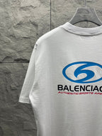 White short-sleeve T-shirt with partial blue Balenciaga logo and neck seam
