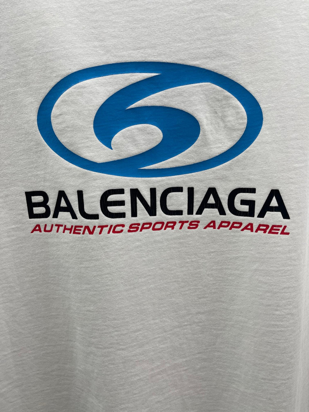 White short-sleeve T-shirt with large blue Balenciaga logo and brand text
