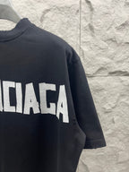 Black Balenciaga T-shirt with partial BALENCIAGA logo on chest and sleeve