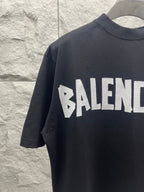 Black Balenciaga T-shirt with partial BALENCIAGA logo across chest