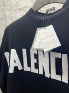 Black Balenciaga T-shirt with large BALENCIAGA logo across chest, tags attached